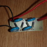 Battery powered high voltage multiplier for gas igniter or stun gun